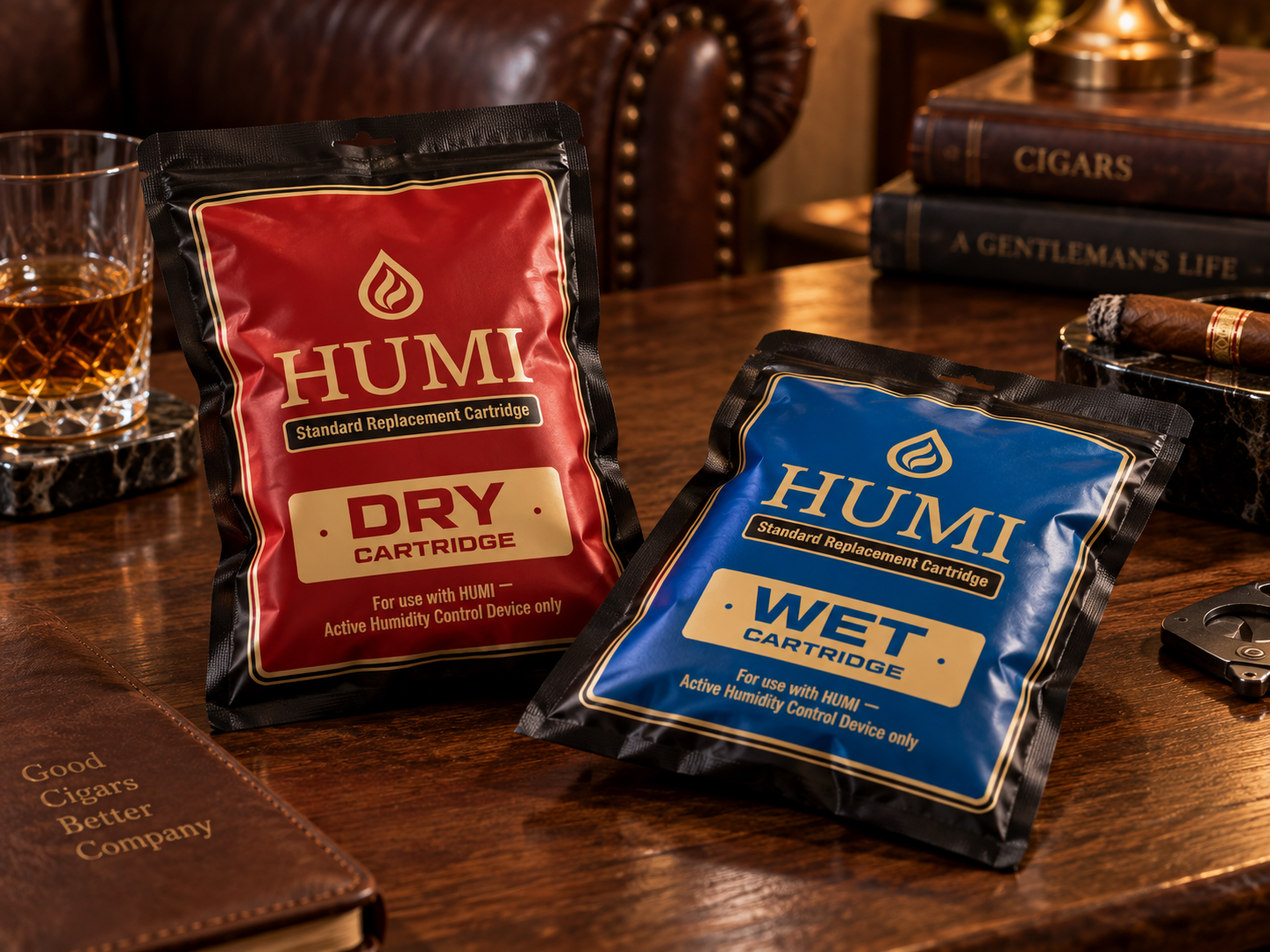 Red DRY and blue WET HUMI replacement cartridge bags on a walnut lounge table